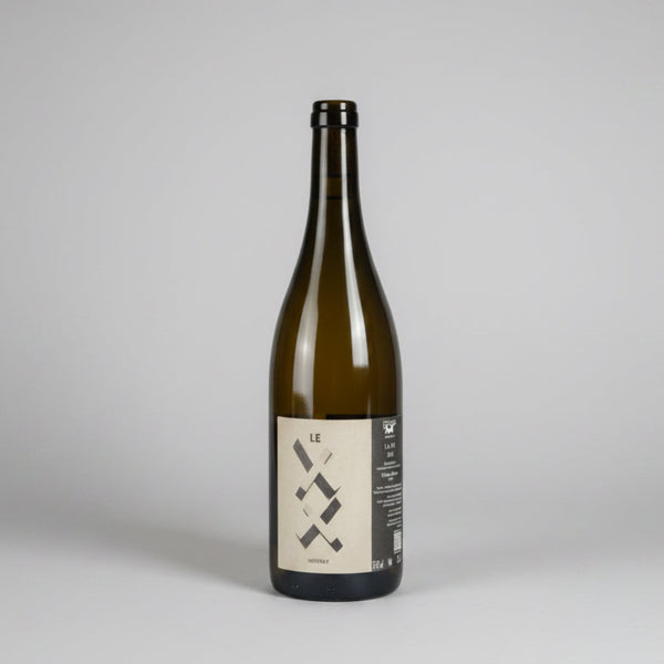 A dark glass bottle of Goustine Le XX Vouvray wine with a minimalist black and beige label.