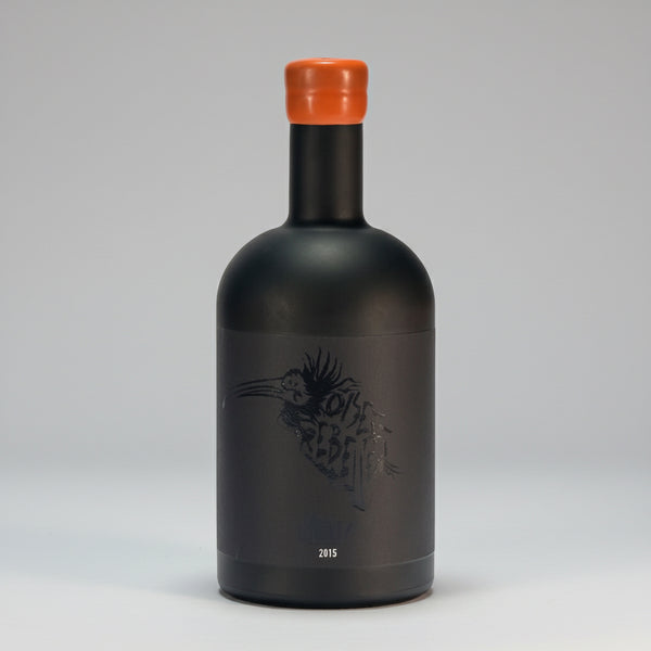 Dry, high-alcohol blanc de noirs from organic Grenache Noir in Banyuls. Bitter orange, saline, umami notes. Minimal SO₂, unfiltered. Oiseau Rebelle 2015.