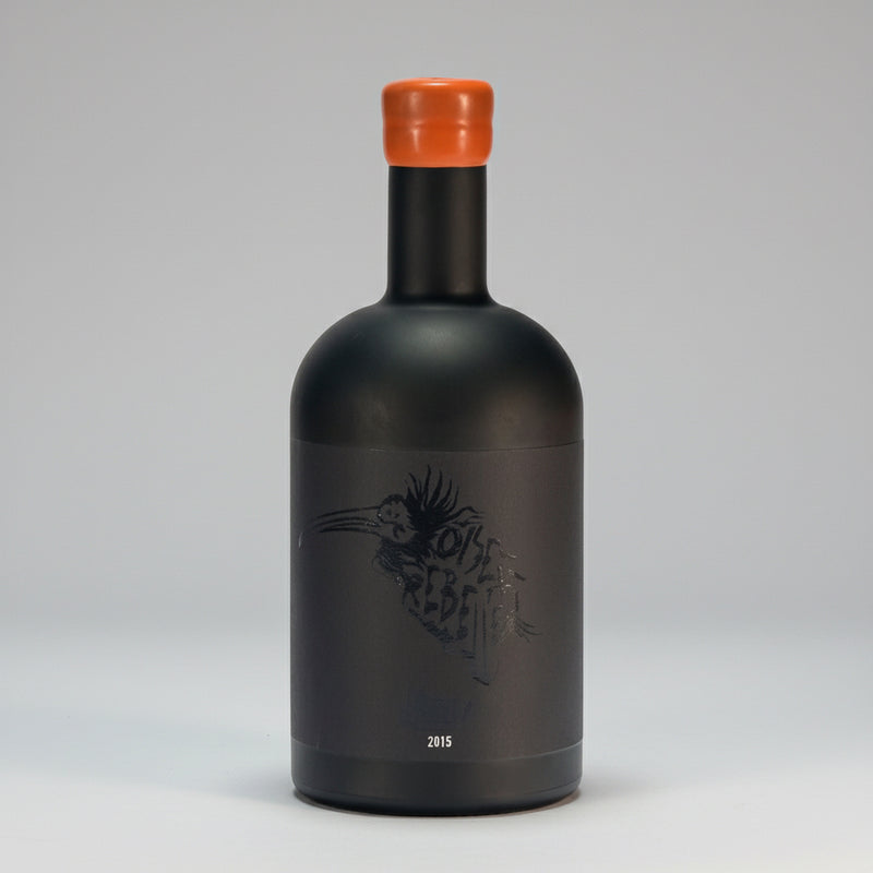 Dry, high-alcohol blanc de noirs from organic Grenache Noir in Banyuls. Bitter orange, saline, umami notes. Minimal SO₂, unfiltered. Oiseau Rebelle 2015.