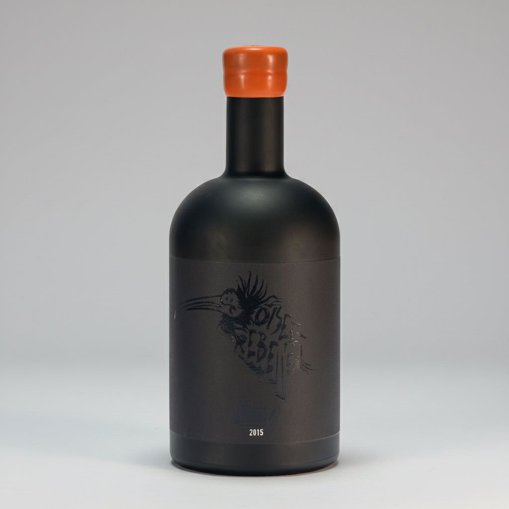 Dry, high-alcohol blanc de noirs from organic Grenache Noir in Banyuls. Bitter orange, saline, umami notes. Minimal SO₂, unfiltered. Oiseau Rebelle 2015.